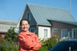 Happy   woman  against  home