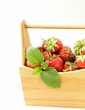 ripe organic strawberries with green leaf