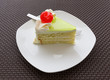 vanilla cake slice and fresh cherry
