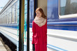 Photo: beautiful woman near a train beautiful woman near a train