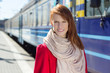 Photo: portrait of beautiful woman waiting for train on the platform portrait of beautiful woman waiting for train on the platform