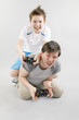 Boy and man playing in videogame