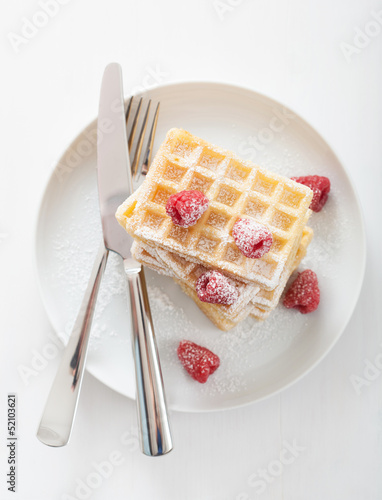 Photo: waffle with raspberry and icing sugar waffle with raspberry and icing sugar