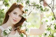 Teen girl near blossom tree
