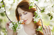 Teen girl near blossom tree