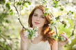 Teen girl near blossom tree