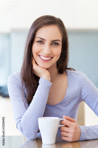 Photo: Woman with cup of coffee Woman with cup of coffee