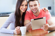 Couple looking at digital tablet