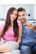 Young couple with TV remote