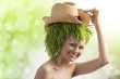 summer girl with hat and grass on head