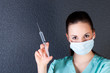 Nurse or doctor with syringe and mask