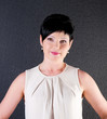 Photo: serious business woman over dark background serious business woman over dark background