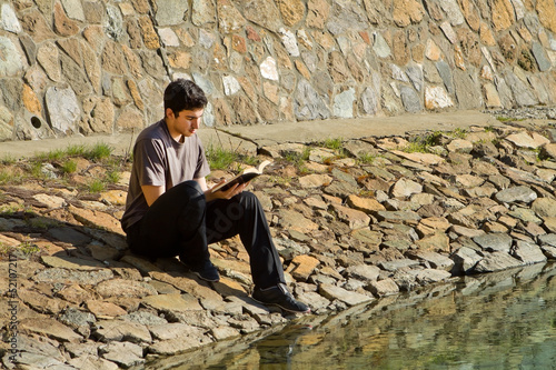 Photo: Man Reading Bible By Lake Man Reading Bible By Lake