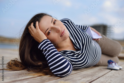 Photo: beautiful pregnant woman on the sea coast beautiful pregnant woman on the sea coast
