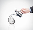 hand with a watering can and flowing clock
