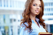 Beautiful business woman on the background of the modern office