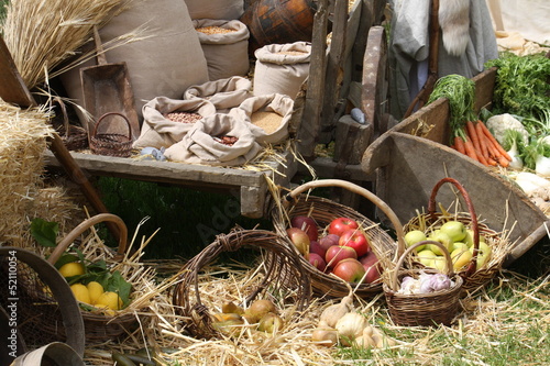 Photo: cart and baskets with seasonal fruit and vegetables for sale at cart and baskets with seasonal fruit and vegetables for sale at