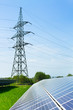 solar panel against high voltage towers
