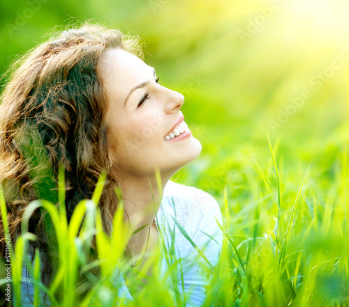 Photo: Beautiful Young Woman Outdoors. Enjoy Nature Beautiful Young Woman Outdoors. Enjoy Nature