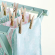 Closeup of laundry drying on wooden drying rack