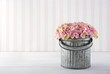 Hydrangea flowers in a metal bucket