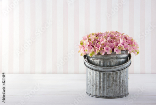 Photo: Hydrangea flowers in a metal bucket Hydrangea flowers in a metal bucket