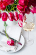 Glass of white wine and a festive table setting