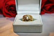 Diamond Rings with Red Roses in the Background
