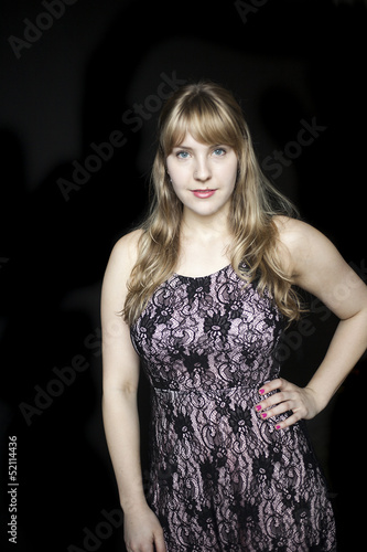 Photo: Young Woman with Beautiful Blue Eyes on Black Background Young Woman with Beautiful Blue Eyes on Black Background
