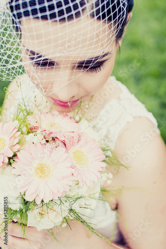 Photo: Bride with wedding bouquet Bride with wedding bouquet