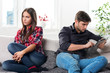 young couple in conflict, a guy with a tablet