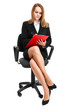 Businesswoman sitting on a chair isolated on white
