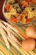 Different types of pasta on striped tablecloth