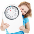 Woman is keeping to a diet shows a pair of scales