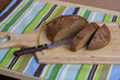 Wooden cutting board with sliced bread