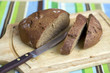 Wooden cutting board with sliced bread