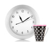 Cup tea and clock isolated on white