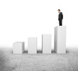 businessman  standing on column