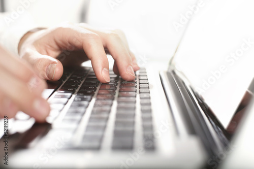 Photo: hands pushing keyboard hands pushing keyboard