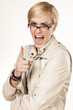 pretty blonde yelling and pointing a finger upwards