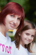 Happy mother and her daughters outdoors