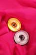 Two buttons on pink background