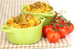 Delicious pilaf with tomato on table close up