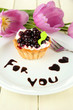 Sweet cake with blackberry and chocolate sauce