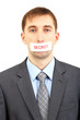 Young businessman with a band on his mouth isolated on white