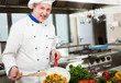 Chef cooking in his kitchen