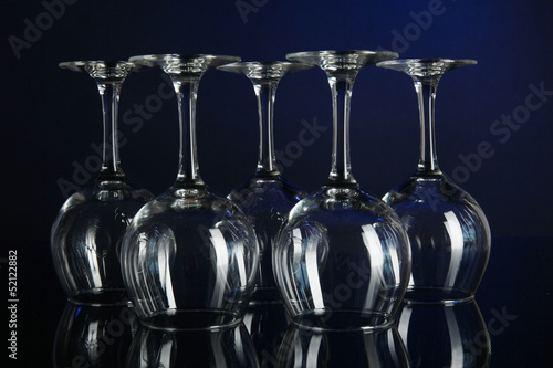 Photo: Glasses on dark blue background Glasses on dark blue background