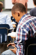 Photo: Male Pupil Sending Text Message In Classroom Male Pupil Sending Text Message In Classroom