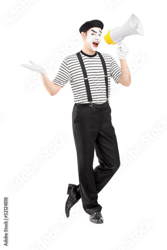 Photo: Full length portrait of a male mime artist speaking at loudspeak Full length portrait of a male mime artist speaking at loudspeak