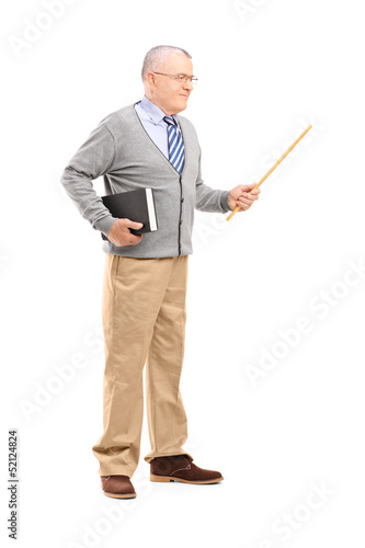 Photo: Full length portrait of a male teacher holding a wand and a book Full length portrait of a male teacher holding a wand and a book